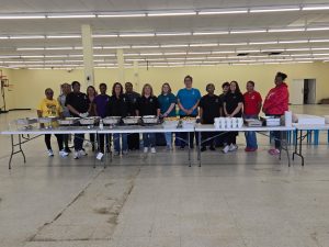 A large group of volunteers helped organize the spaghetti dinner fundraiser.