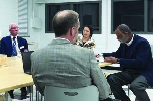 The March 6 Henry County School Board meeting marked the final session for Stephanie Brinegar, of the Horsepasture District. She is seated beside Ben Gravely (right), vice chairman, of the Iriswood District, and Champ Hardie (left) of the Ridgeway District.