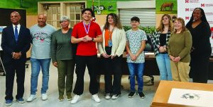 Members of the Martinsville School Board and staff recognized the accomplishments of the Swim Team, which competed at the state level. Sherman Dillard won the state title, Ben Puckett was awarded second place in the diving competition.