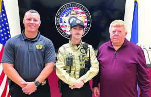 Henry County Sheriff’s Deputy Clayton Craig (center) is pictured with Capt. Tim Compton (left) and Michael Jarrett, of Jarrett Marketing LLC.