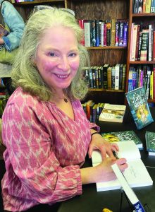 L.C. Maxie signs copies of her new release Lady Slippers at Magnolia & Main Books. 