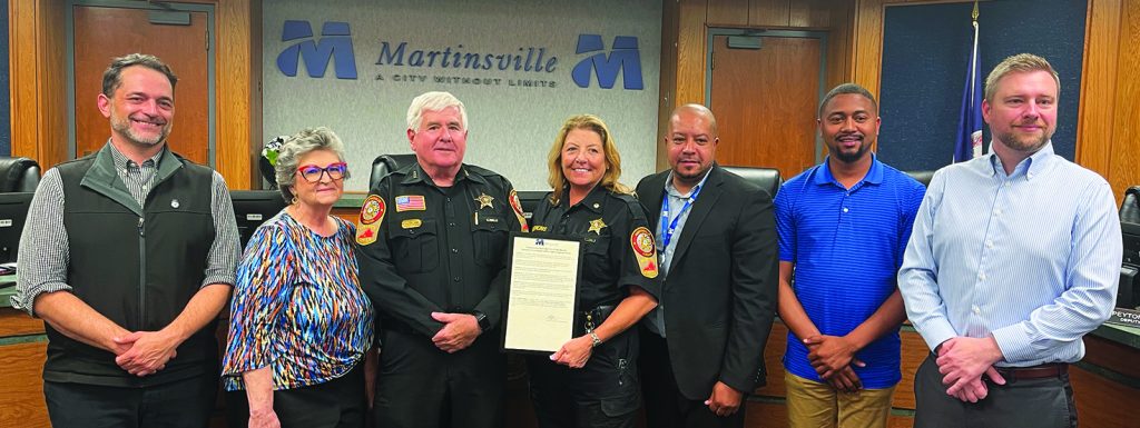From left, council member Julian Mei, Vice Mayor Kathy Lawson, Martinsville Sheriff Steve Draper, Sheriff’s Maj. Laura Hopkins, Mayor LC Jones, council members Rayshaun Gravely and Aaron Rawls are pictured presenting a proclamation for National Corrections Officers and Employees Week.