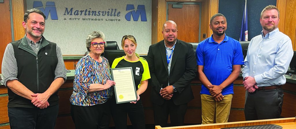 The city council presented the proclamation for National Arbor Day to Martinsville Tree Board member Heather Loeberger.