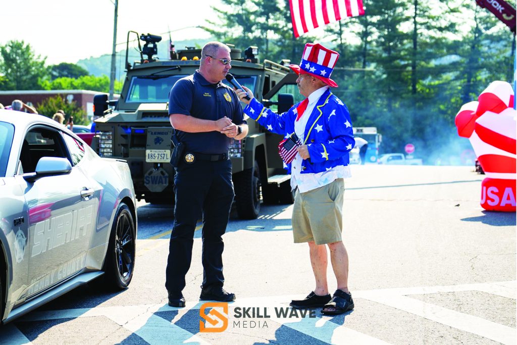 Henry County Sheriff Wayne Davis leads the Fieldale Independence Day Parade on July 4. He is interviewed along the route by Charles Roark of Star News. (Photos courtesy of Skill Wave Media.)