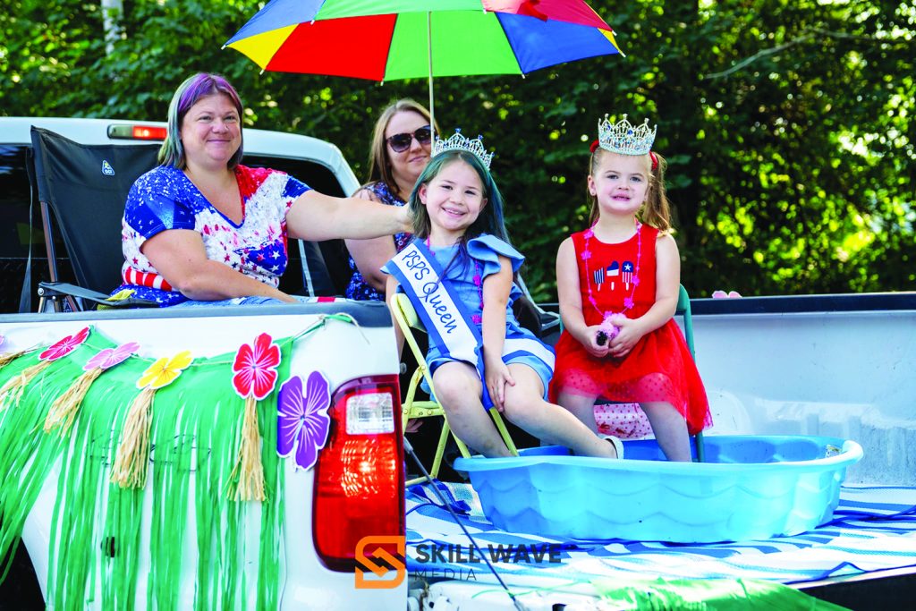 Local beauty queens and their entourages wave to the crowd as part of the Fieldale Fourth of July tradition.
