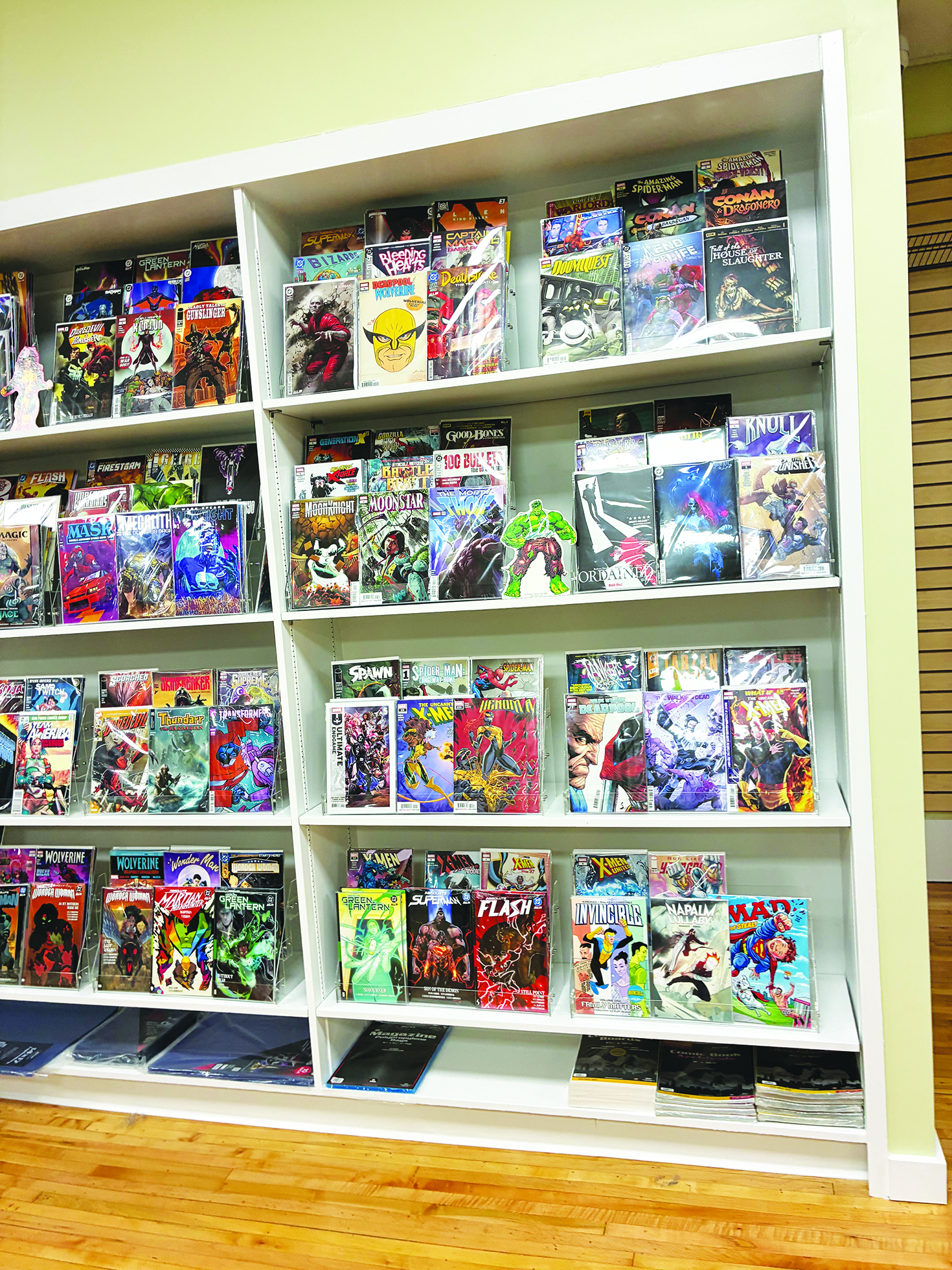The store features collectibles including Pokémon items, comics and tabletop games.