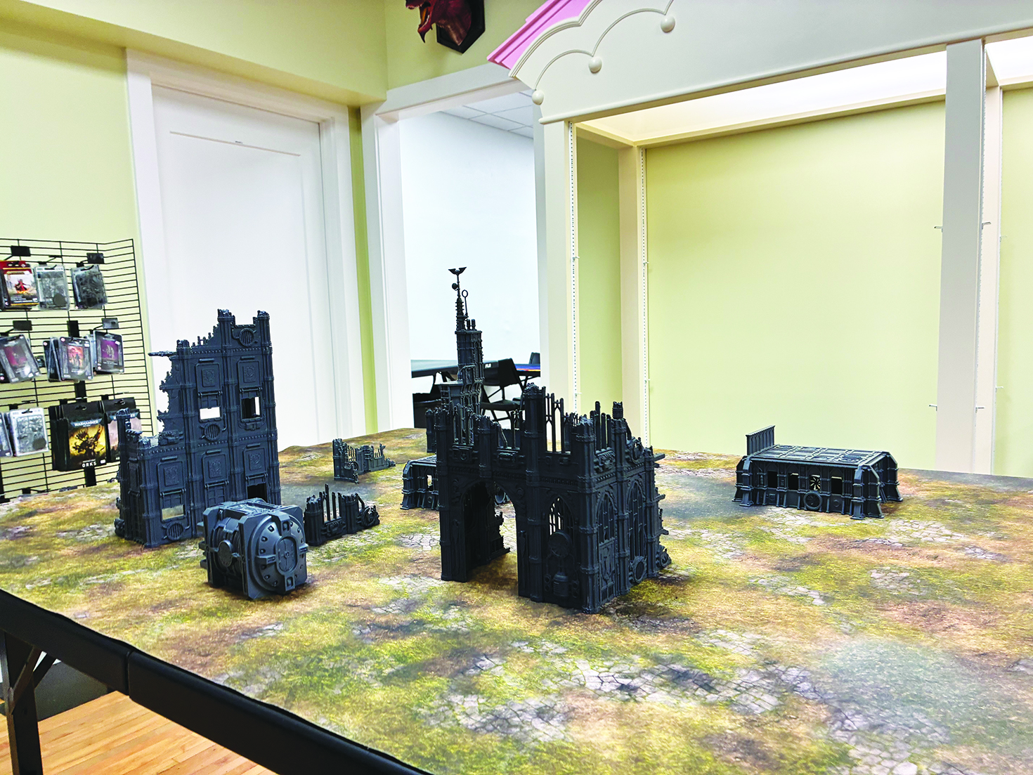 The store features collectibles including Pokémon items, comics and tabletop games.