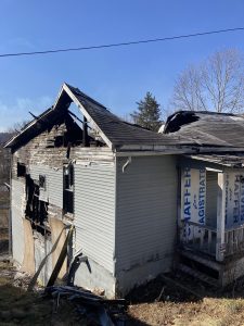 abandoned home, heavily damaged by fire, caving in