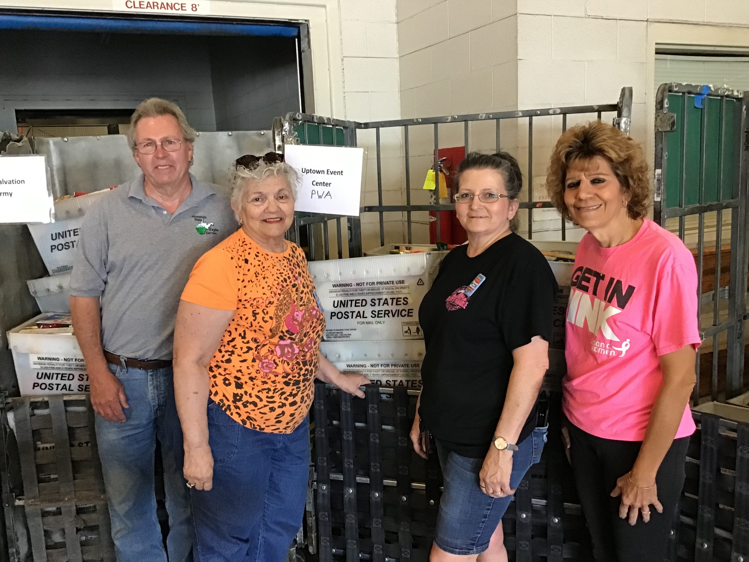 group of people with postal service boxes