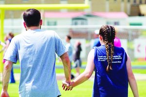 two students holding hands