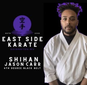 Carr in white karate uniform with the logo of East Side Karaoke