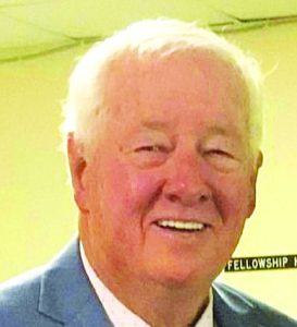 a picture of the candidate, older man, squinted eyes, smiling, white hair