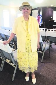 candidate in yellow dress and yellow hat