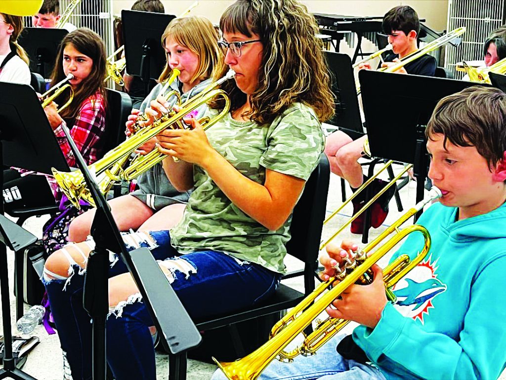 Vance and several kids playing instruments