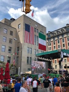 courthouse with green, red and white Italian flag, stage with green awning