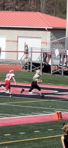 Nick running into end zone, with Bridgeport team member behind him