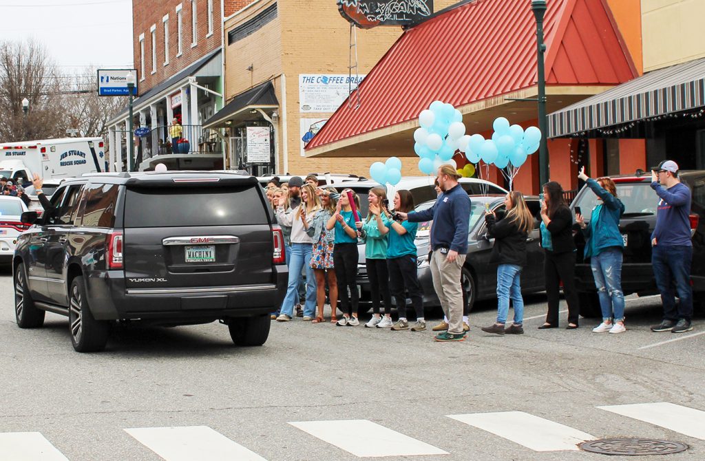 Classmates blew kisses, waved and cheered as Lauren and her parents drove past.