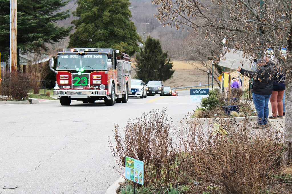 Led by first responders Lauren’s motorcade comes up Main Street on Friday.