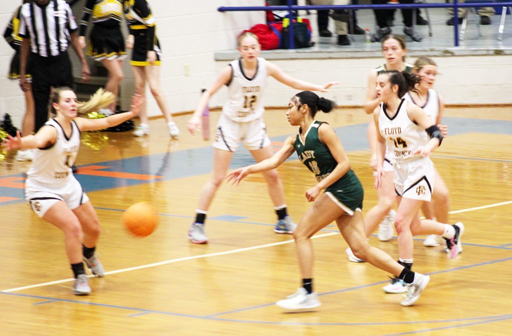 Shauntel Hill fires a pass through the Floyd defense.