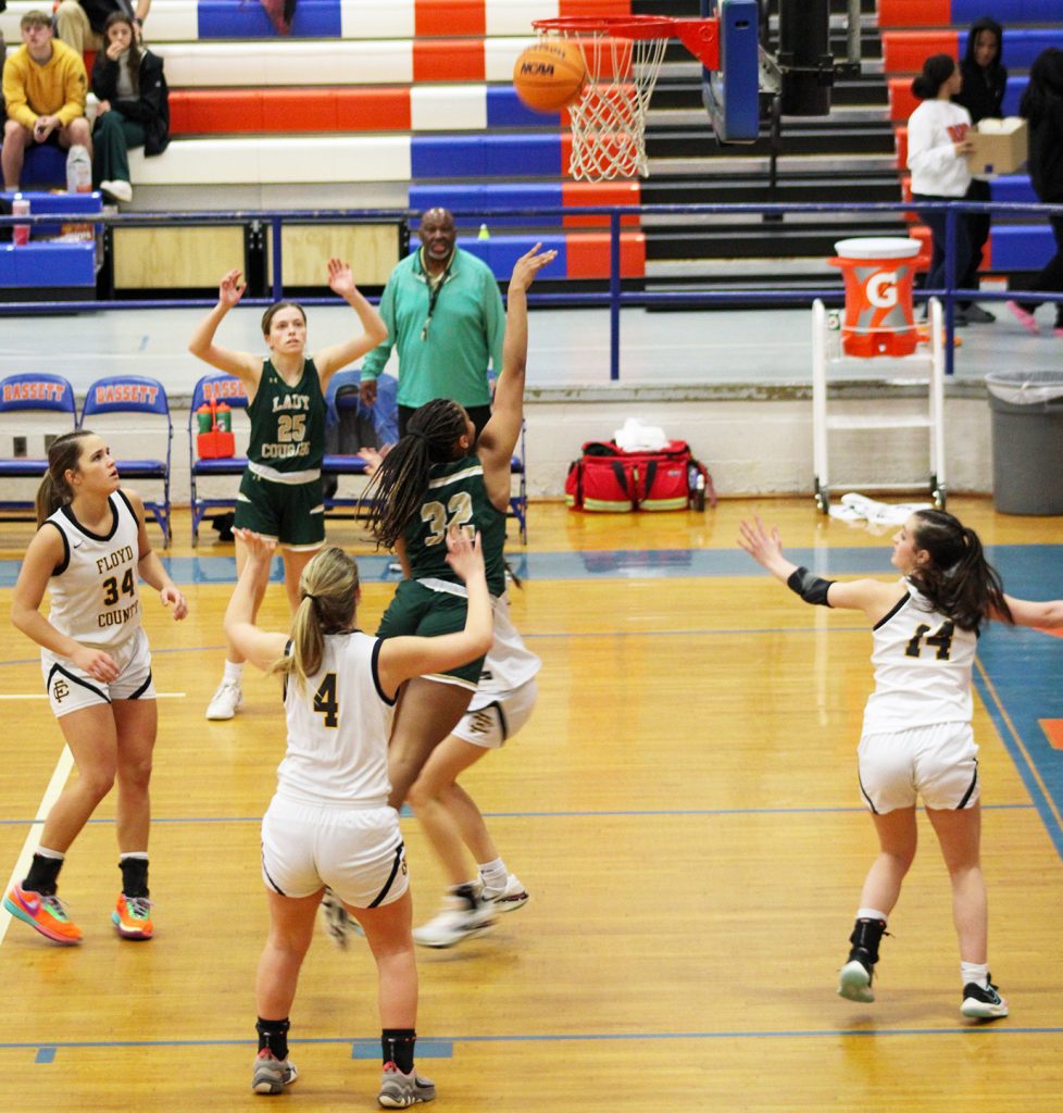 Surrounded by Floyd defenders, Kimora Wimbush puts up the shot.