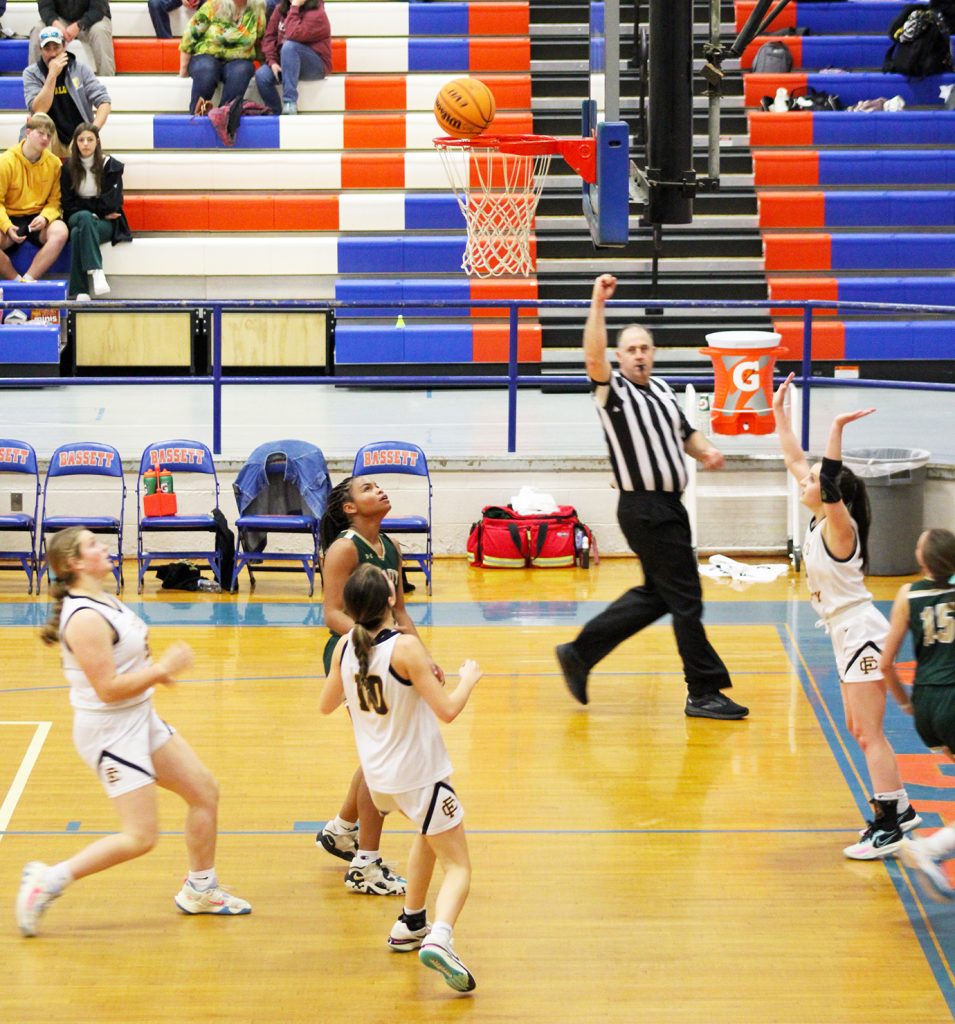 The ball hangs on the rim after a Kendra Worley shot.