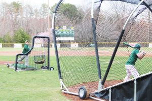 Coach Tal Swails throwing batting practice.