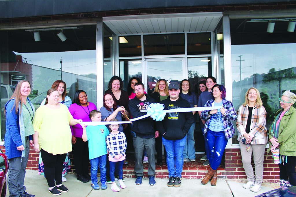 CPB Behavioral Therapy and Advocacy Services staff and others cut the ribbon on their new, larger, location.