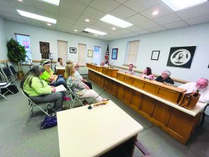 Members of Stuart Town Council heard concerns from several of those attending last week’s meeting. Council members, (pictured left to right) are Dave Hoback, Mayor Ray Weiland, Erica Cipko Wade and Town Attorney Chris Corbett.  