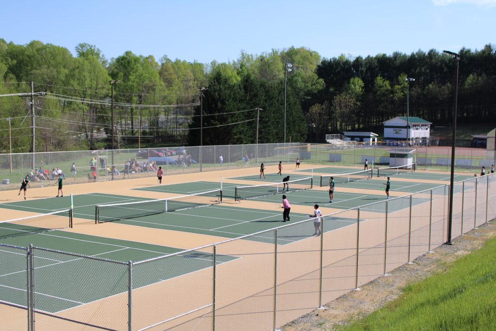 All five courts were active in the Cougars first home match in years
