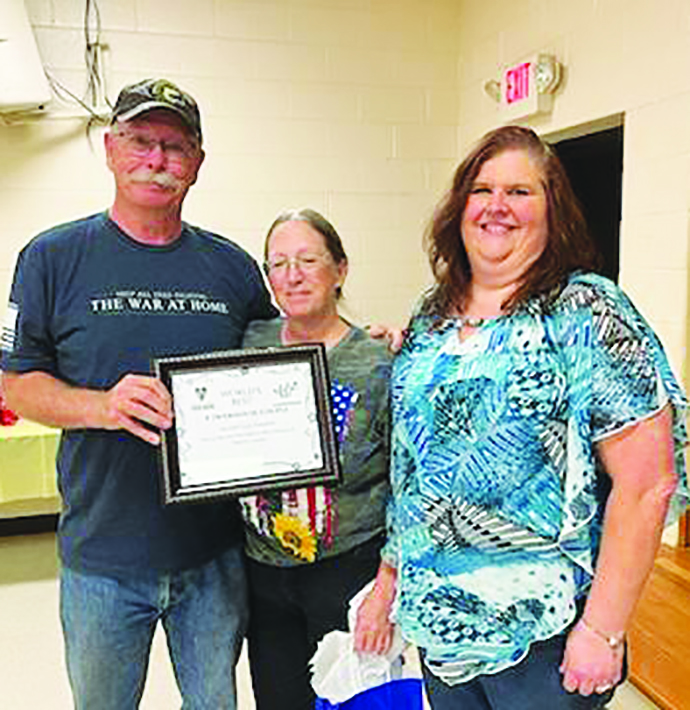 Stuart and Cindy Hampton (left and center) were named the Powerhouse Couple of the Year.