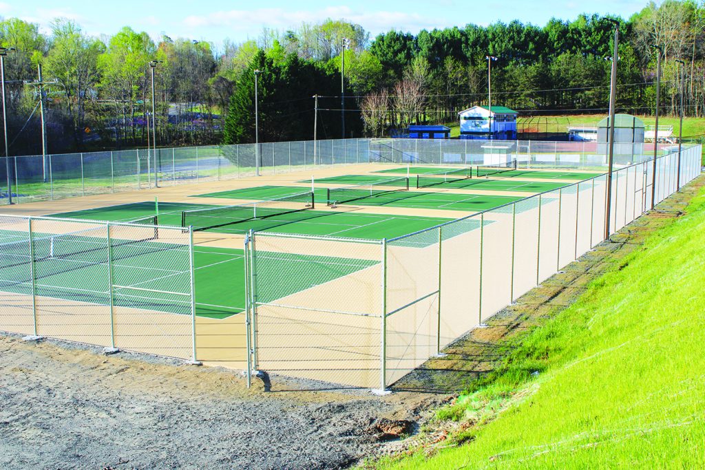 Patrick County High School (PCHS) is sporting beautiful new tennis courts, painted in the classic Cougar colors of green and gold. (By Pat Delaney)