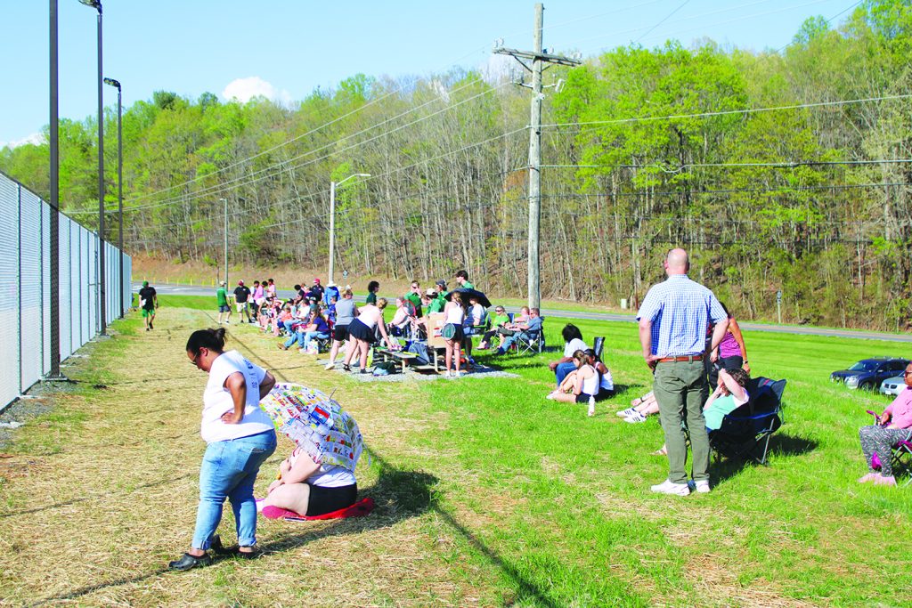 Parents and other spectators watch the Cougars on their new home courts.