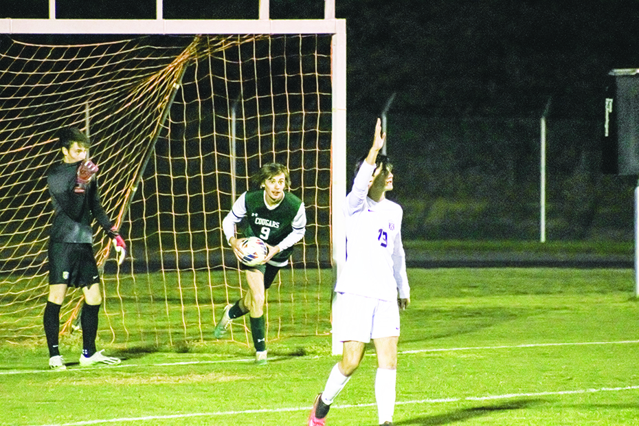 Colby Laymen grabs the ball after scoring a second half goal.