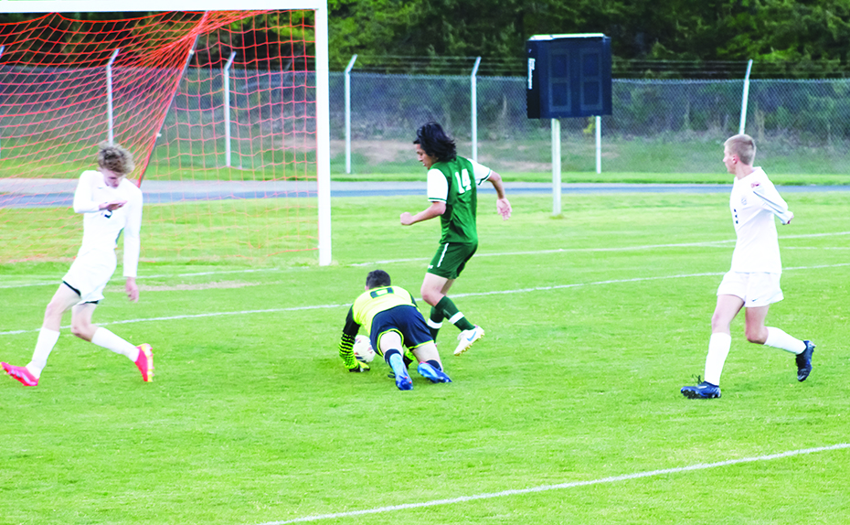 Jonah Byers (#0) leaps on the loose ball after stopping the Glenvar shot.
