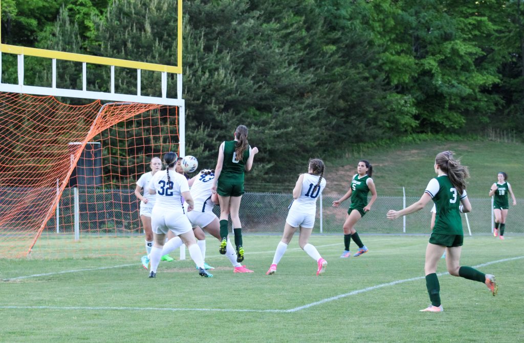 Camille Gonzalez (#6) goes airborne for a Lady Cougar goal.