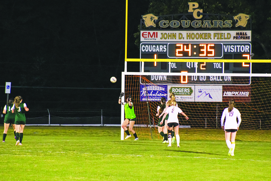 Madi Heath makes one of her seven saves in the second half.