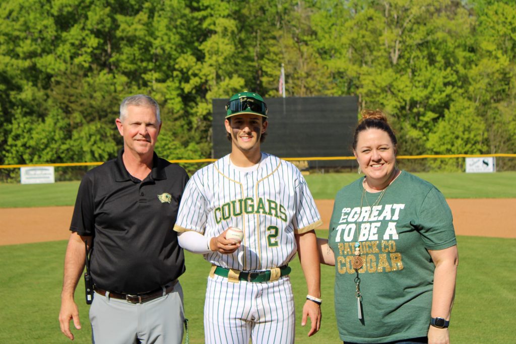 Tucker Swails was presented with his 300th strikeout ball by Patrick County athletic director Terry Harris and principal, Hope Perry.