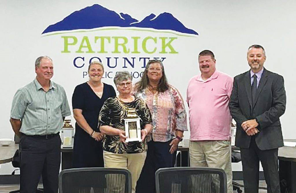 Members of the Patrick County School Board recognized several retirees, including Cecelia Coutu (center). Board members (left to right) Walter Scott, Shannon Harrell, Amy Walker, Rob Lawson, and Superintendent Jason Wood.