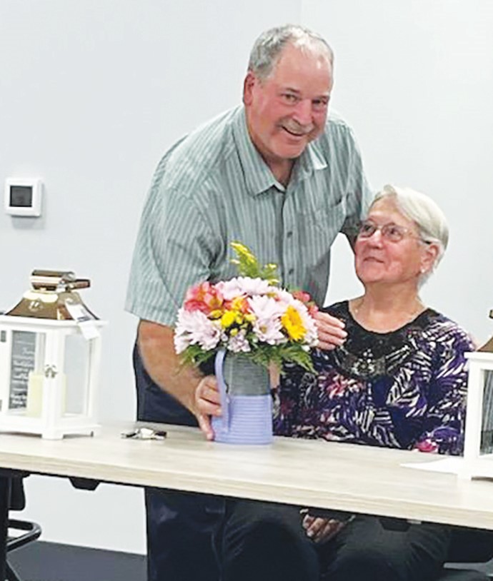 Walter Scott, vice chairman and of the Smith River District, presented Shelia “Cookie” Lawson with flowers to celebrate her retirement.