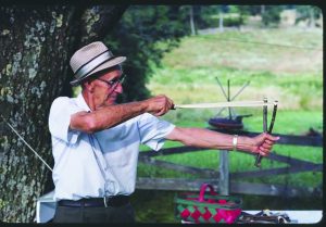 Matt Burnette demonstrating his handmade slingshot. (Photo from Library of Congress)