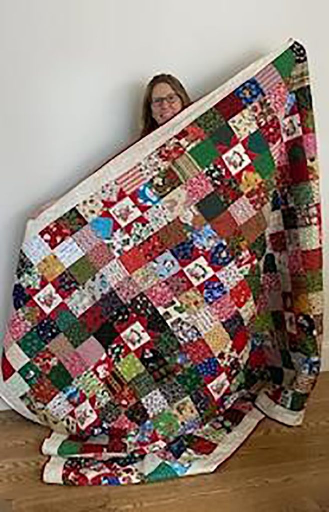 The Mountaintop Quilters of Vesta and Meadows of Dan donated a Christmas quilt for a raffle to benefit the community center. Carla Frisch was the lucky winner of the colorful quilt this year.