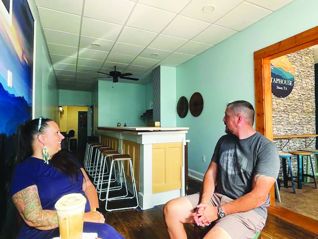 Warren and Crystal Lenehan take a break in the new Blue Ridge Taphouse, located in the former Leonardo’s Pizzeria & Bistro.