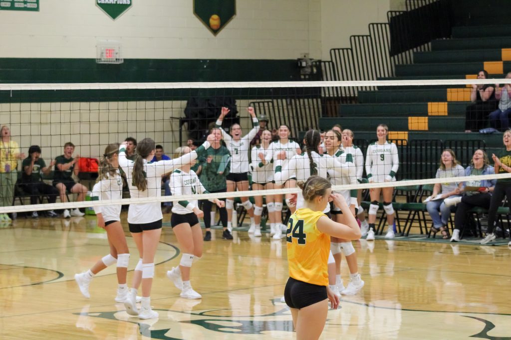 The Lady Cougars react to coming back from nine back to tie the set.