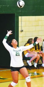 Kendra Penn serves for the Cougars.