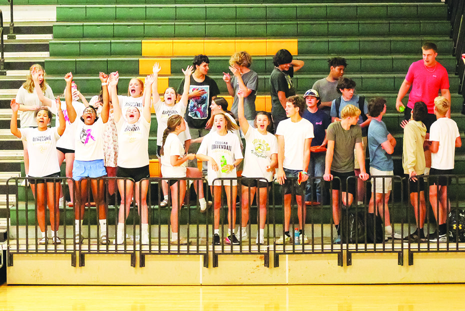 The Cougar student section reacts to a point won