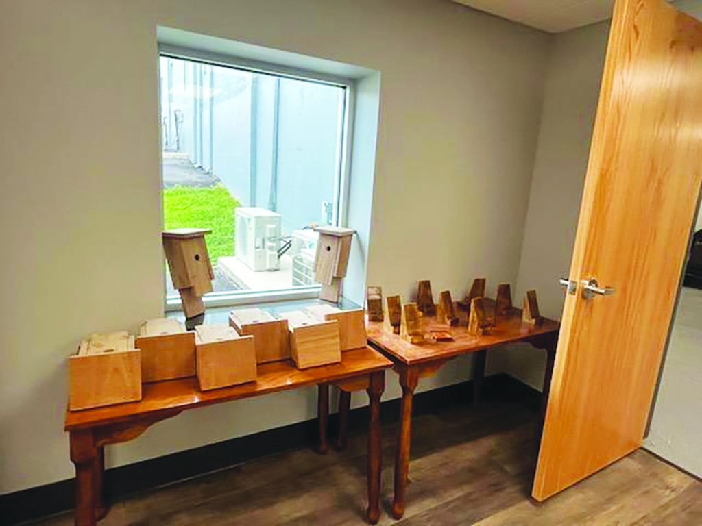 Wooden items made at Patrick County High School (PCHS) like bird houses, cell phone holders, and tables are available for purchase at the marketplace.