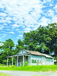 The humble abode known to many local residents as Blind Man Martin house is pictured before it was demolished to the last splinter as work on the U.S. 58 project continued its march. 