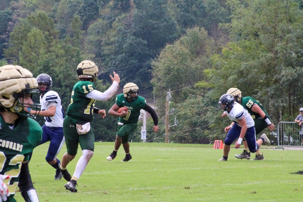 Avonne Kidd rolls out past the Cavalier defense