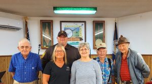 Pictured from left to right are Otto Hiatt, Deputy Eric Sain, Waymond Dawson, Jules Easter, Dispatcher Karen Campbell, and Diane Dawson. (Photo by Mary Dellenback Hill, Secretary, Willis Gap Community Center.)