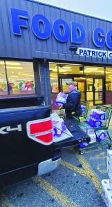 Water and paper products will be taken to those in need in Asheville N.C. The Patrick County Food Bank and Food Country in Stuart worked to load the items Monday. 